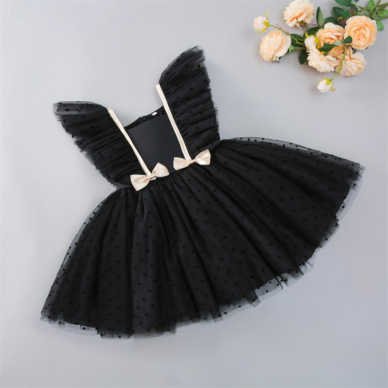 Special occasion infant dress, white, with elegant mesh sleeves, ideal for parties and formal events.