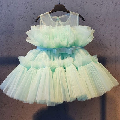Baby girl's elegant white dress with puffy mesh sleeves, perfect for any special formal event.