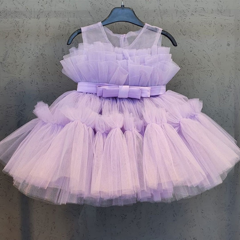 Formal knee-length dress for girls, featuring ornate puffy mesh sleeves for a chic party look.