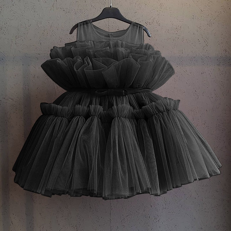 Infant special occasion dress, white, with lovely puffy mesh sleeves and a comfortable knee-length.
