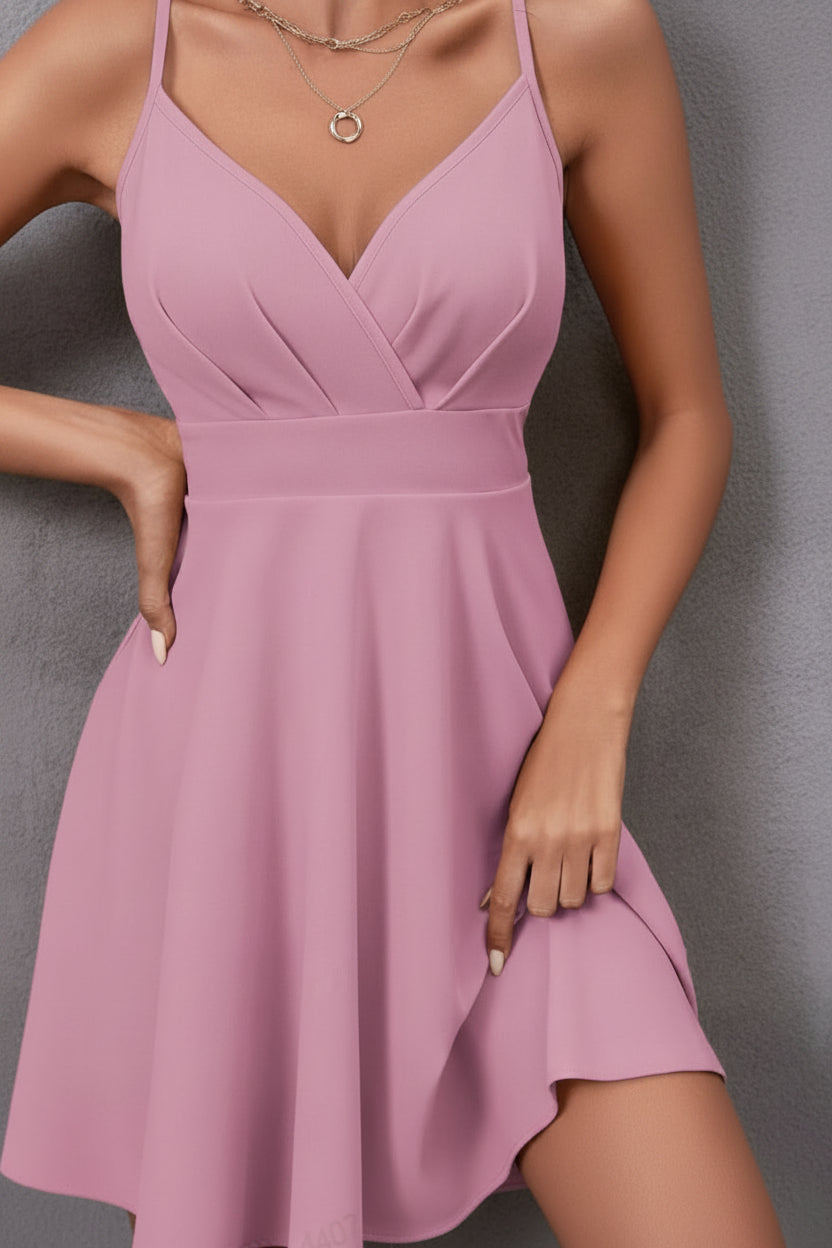 Glamorous backless party mini dress. Elegant sleeveless design for women.