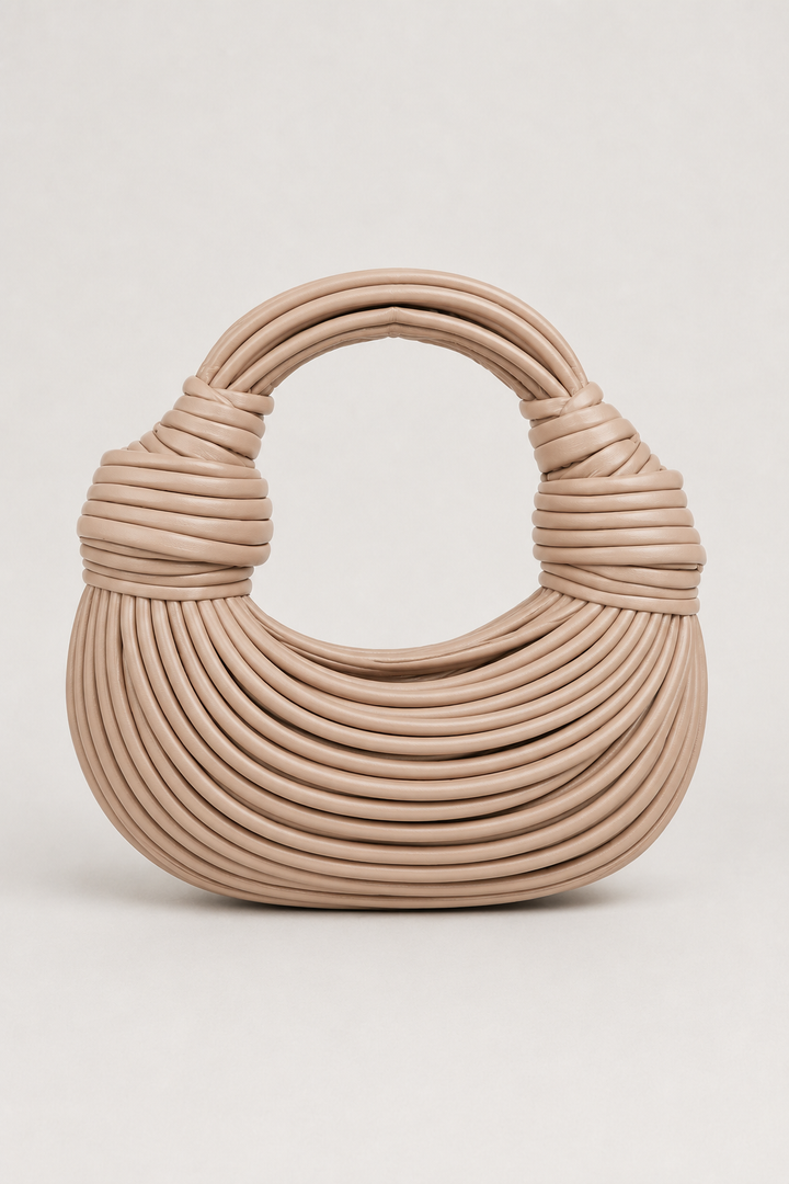 Gold knot-handle crescent shoulder bag. Modern women's elegant handbag, perfect everyday accessory, spacious & stylish.