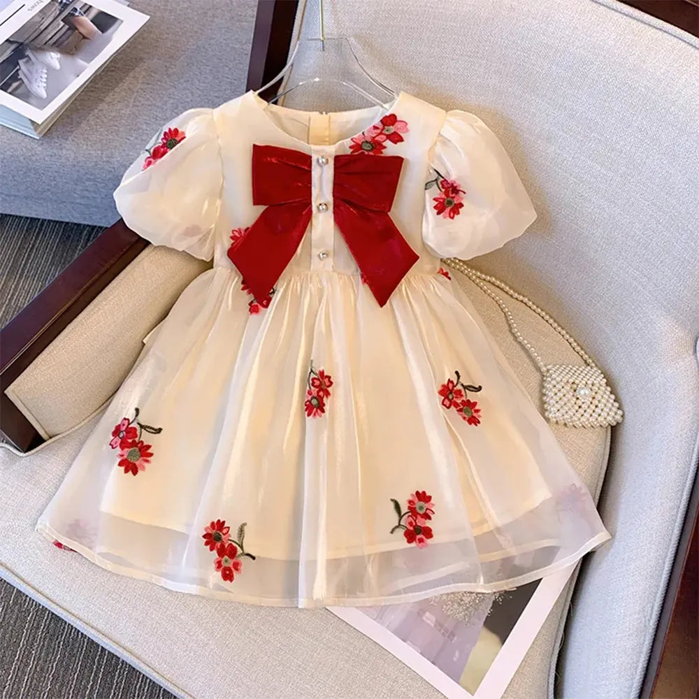 Elegant beige princess dress for toddlers, perfect for summer parties, with a full skirt and delicate details.
