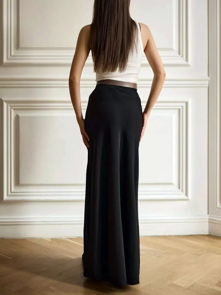 Timeless navy high-waist fishtail maxi skirt for a polished evening look.