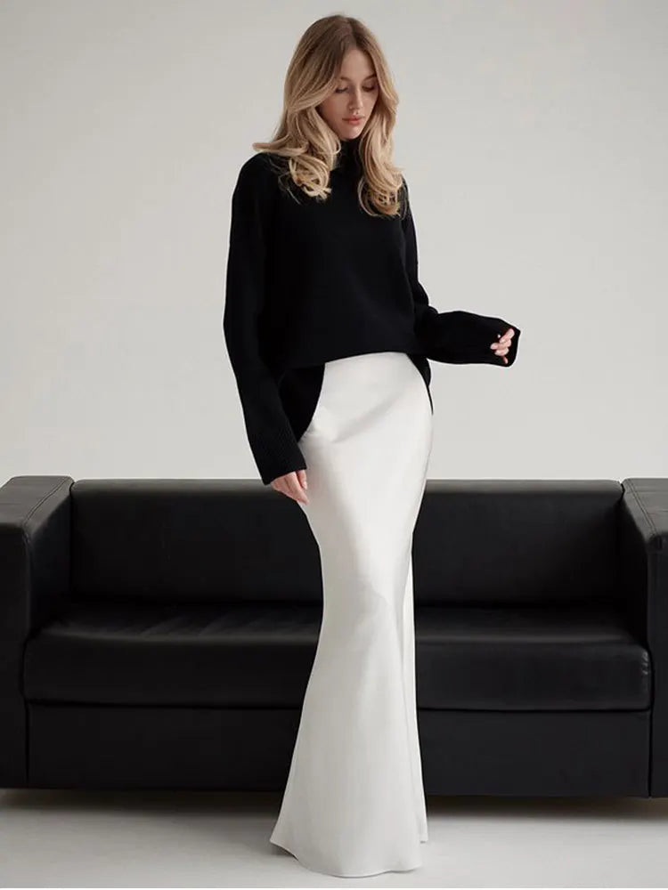 Deep forest green elegant fishtail maxi skirt, high-waisted for formal events.