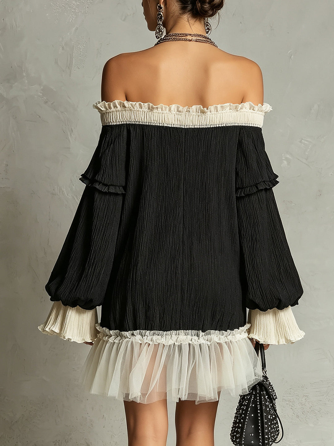 Sophisticated black off-shoulder mini dress for women. Elegant design with lace detailing & graceful ruffles. Date night style.