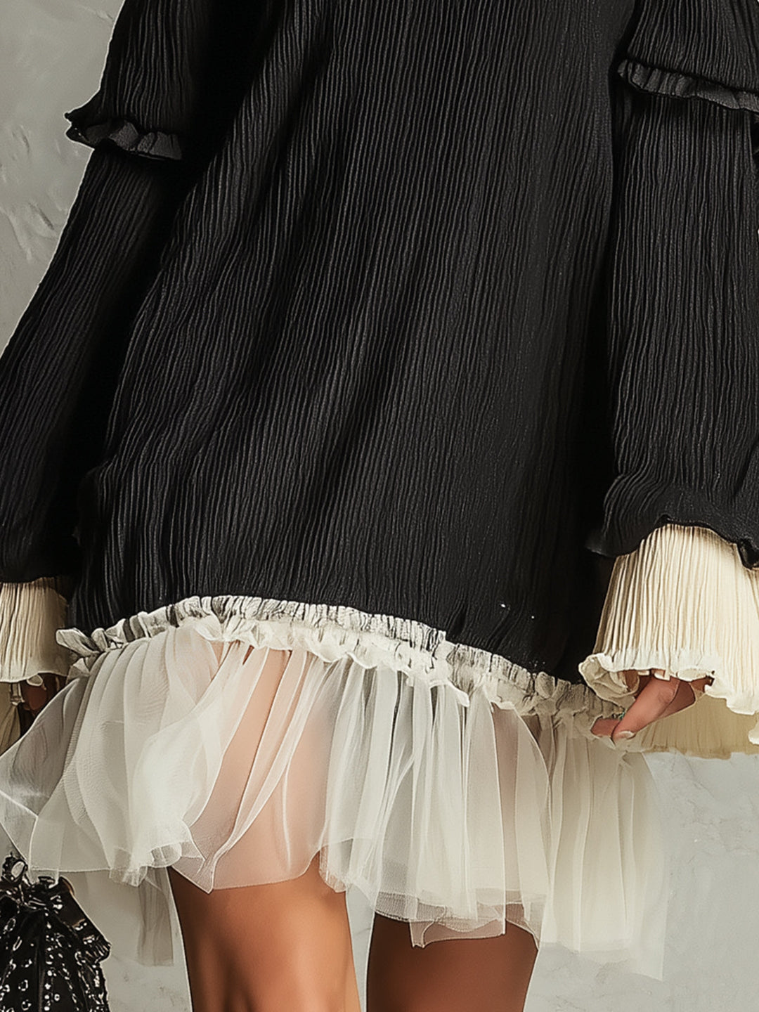Stylish women's black off-shoulder mini dress featuring intricate lace and playful ruffles. Perfect for elegant events.