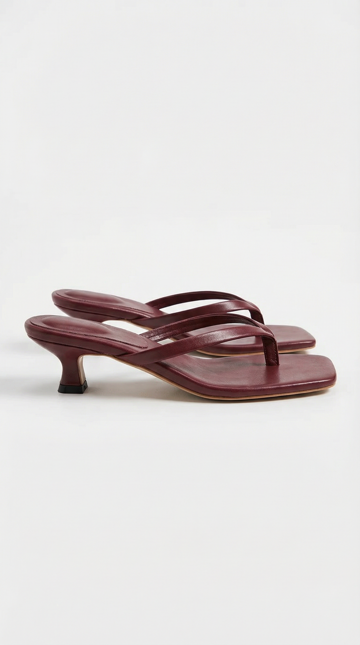 Chic brown square toe thong kitten heel sandals for women. Modern elegant summer footwear.