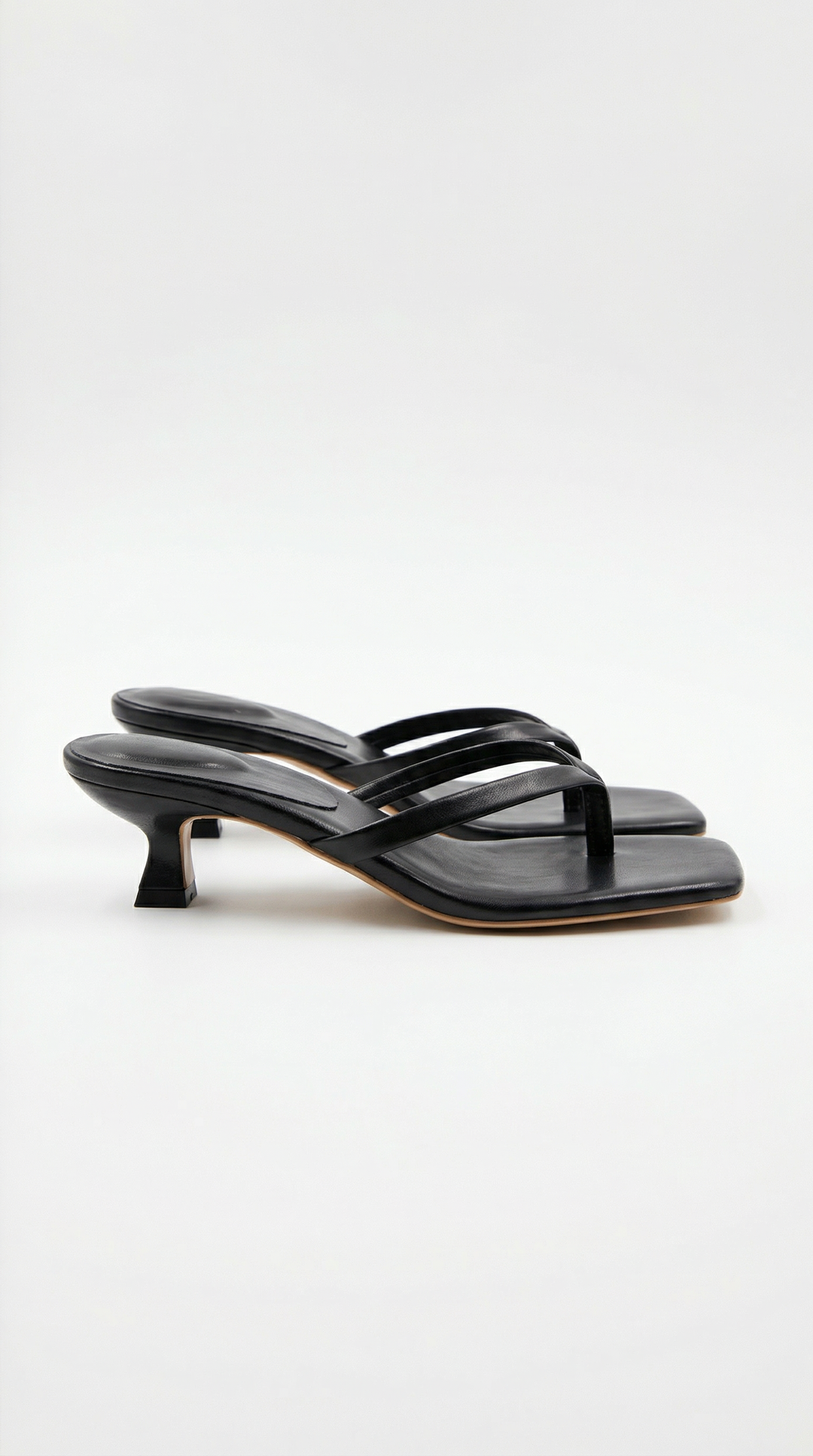 Women's black kitten heel sandals with square toe & thong strap. Perfect for dressy occasions.