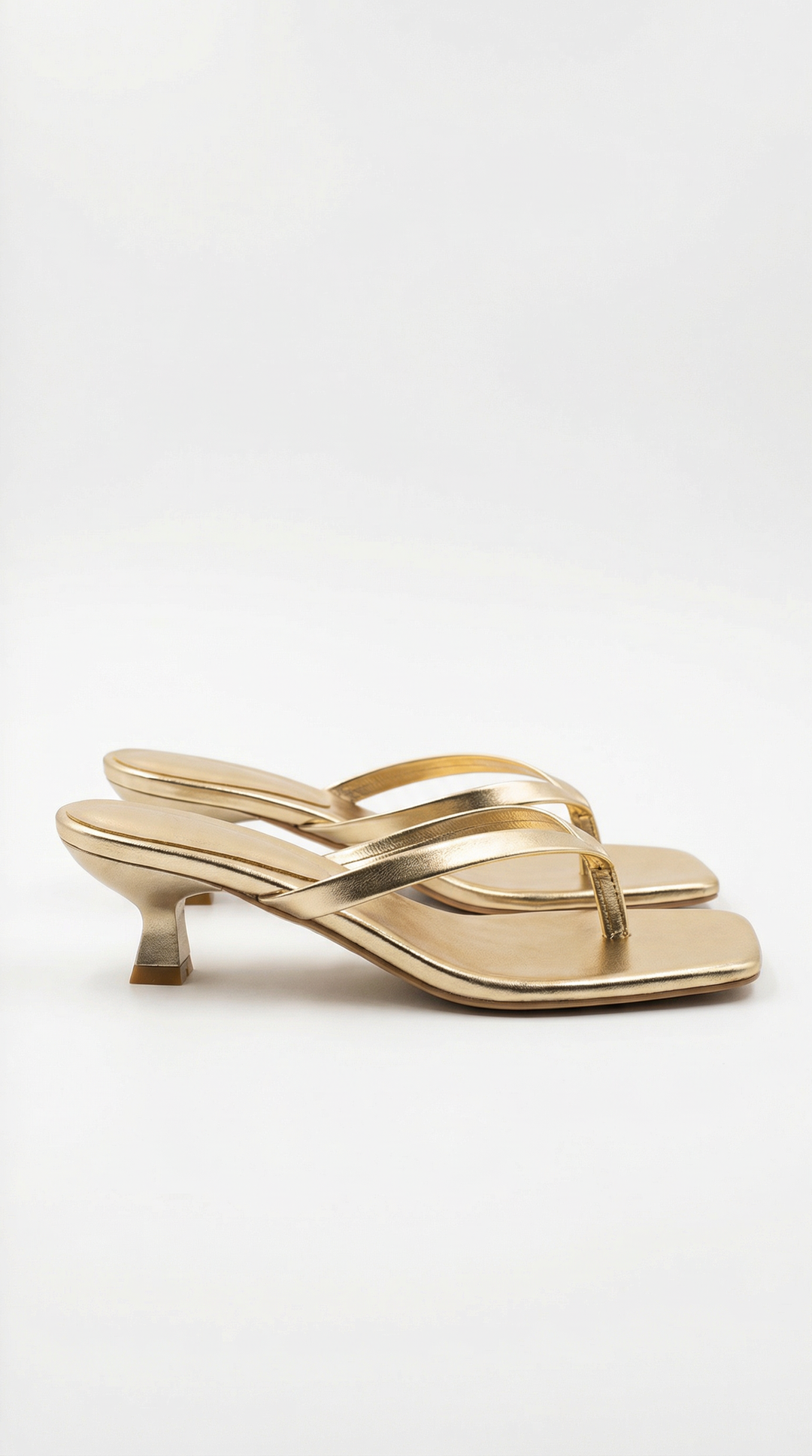 Women's gold kitten heel thong sandals with square toe. Versatile dressy summer heels.