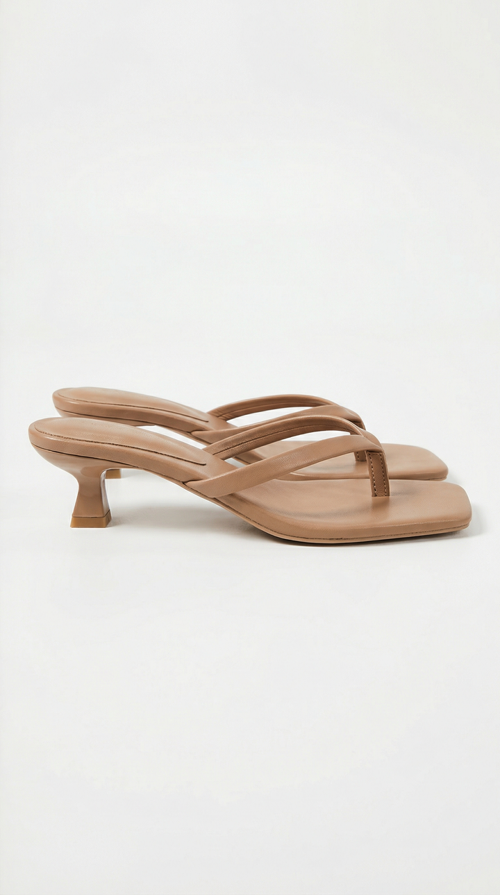 Elegant beige square toe thong kitten heel sandals for women. Modern summer dress heels.