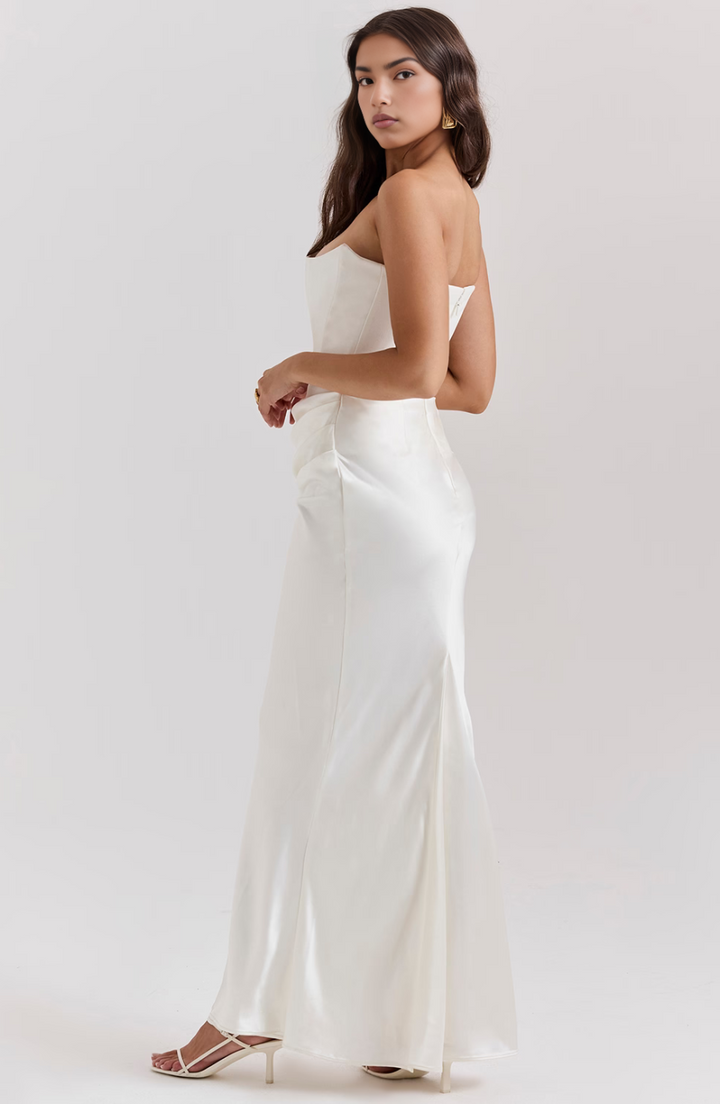 Women's elegant strapless wedding guest dress, a long corset-style party gown.