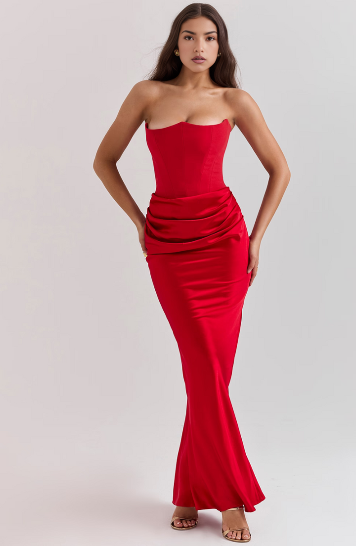 Sleek black strapless maxi wedding guest dress, featuring a flattering corset bodice.