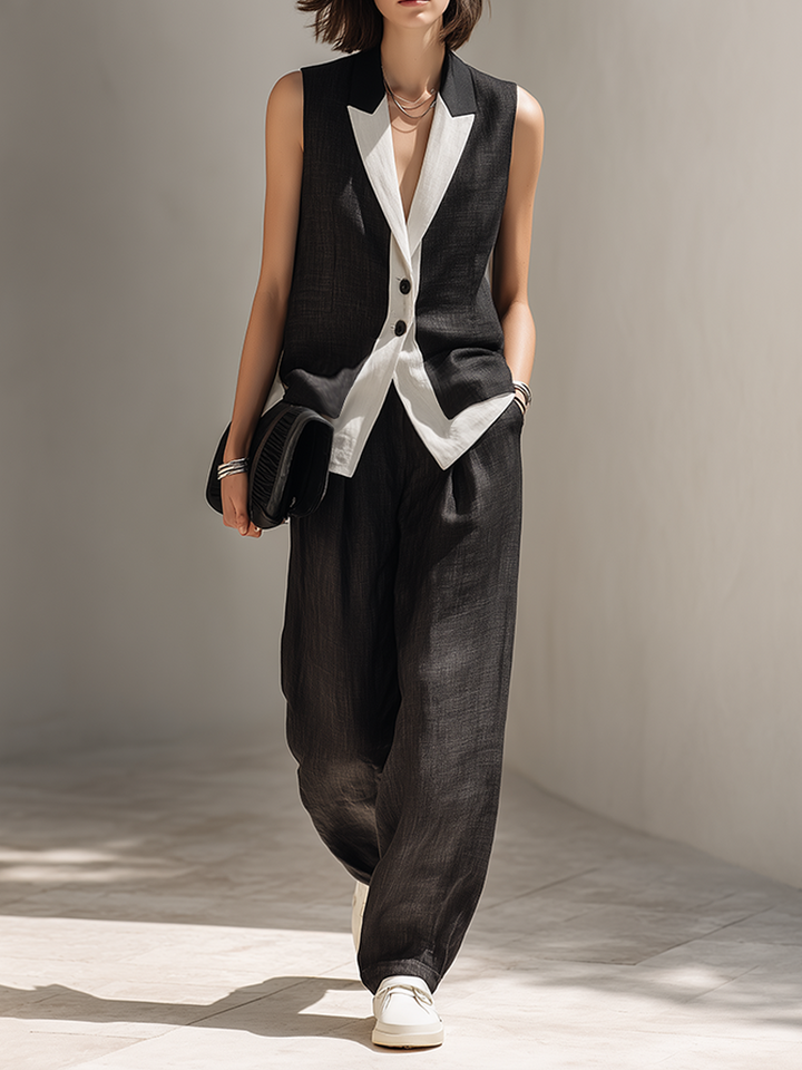 Elegant black tailored two-piece set for women, featuring a chic vest top & wide-leg pants. Perfect for office or evening.