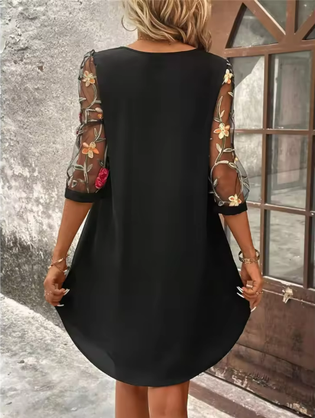 Romantic women's black V-neck dress featuring delicate sheer sleeves & a flattering fit, ideal for elegant occasions.