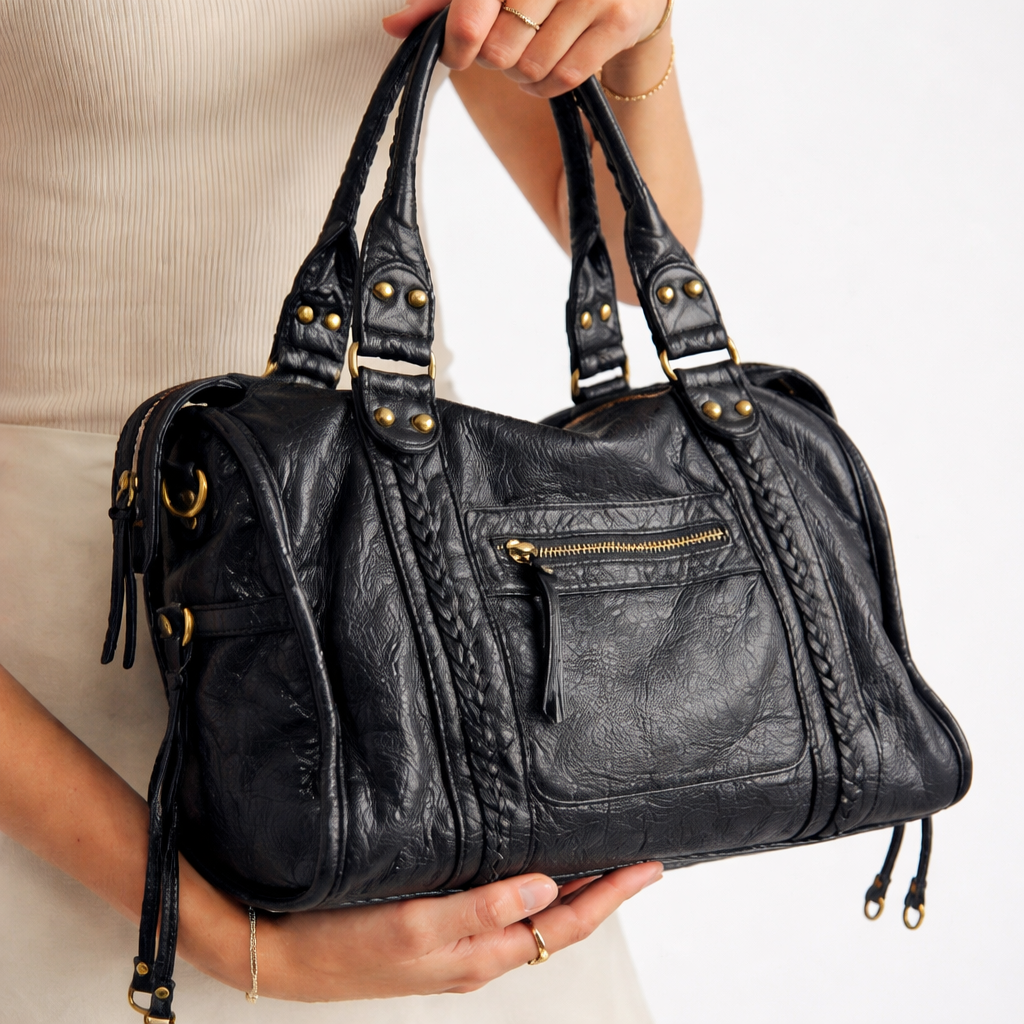 Elegant black women's shoulder bag, versatile for everyday use & fashion. Stylish crossbody ladies' accessory for daily carry.