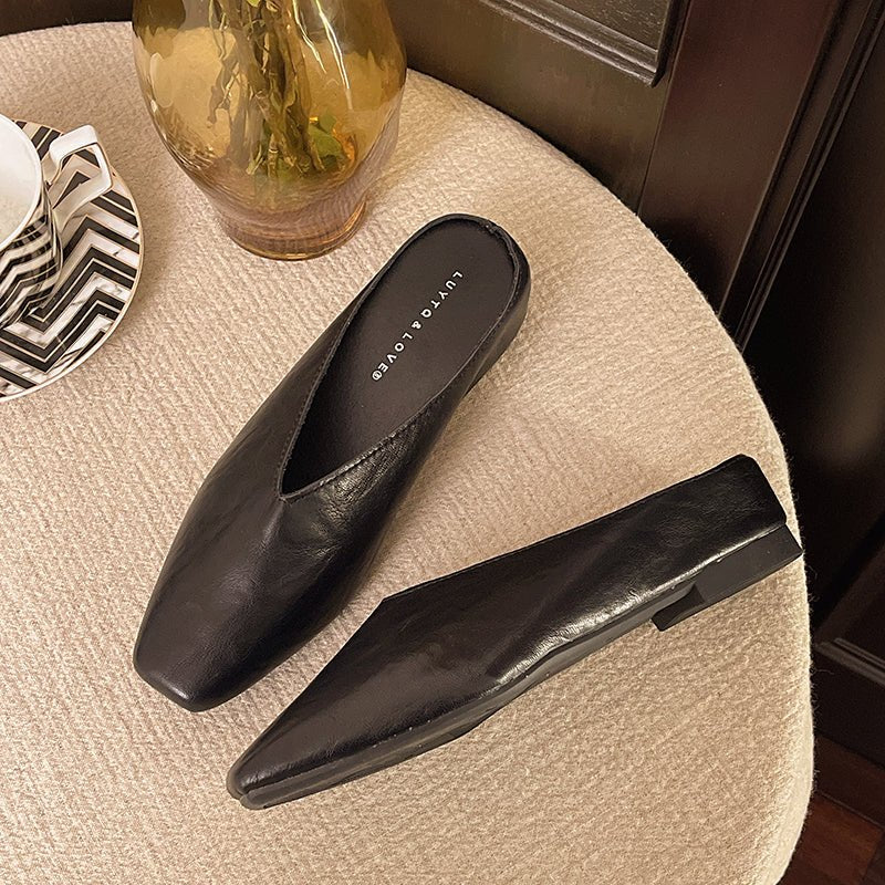 Stylish women's square toe flats in navy, a versatile slip-on shoe perfect for spring outfits.