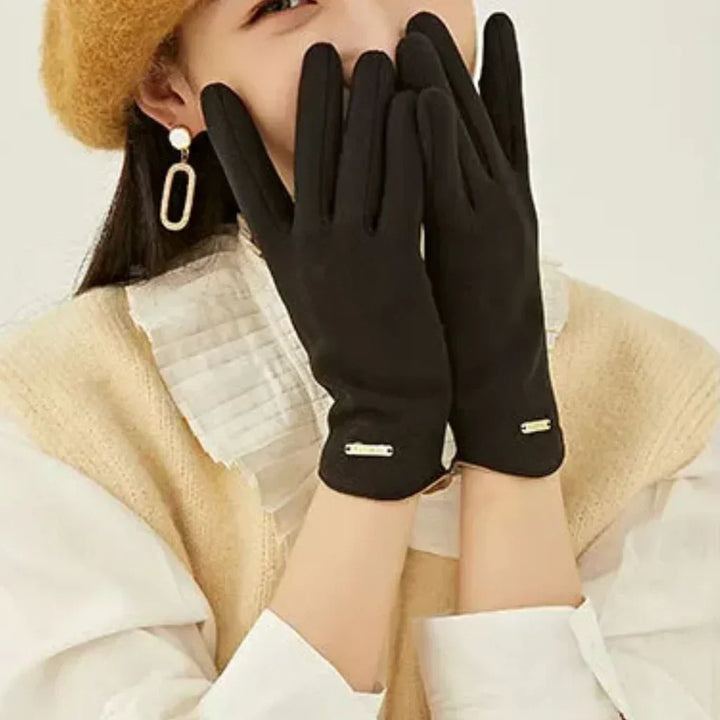 Gray women's versatile winter gloves, offering warmth and touchscreen functionality.