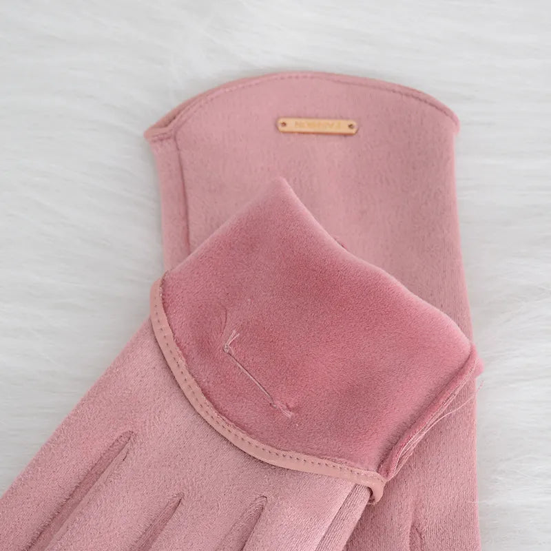 Black women's winter gloves, elegant and touchscreen compatible for cold days.