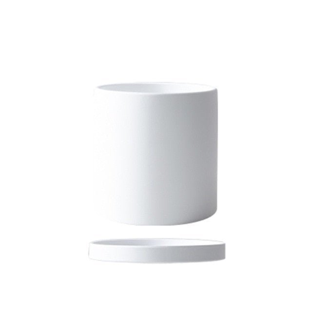 Ceramic flowerpot set with saucer, offering an elegant solution for indoor plant care.