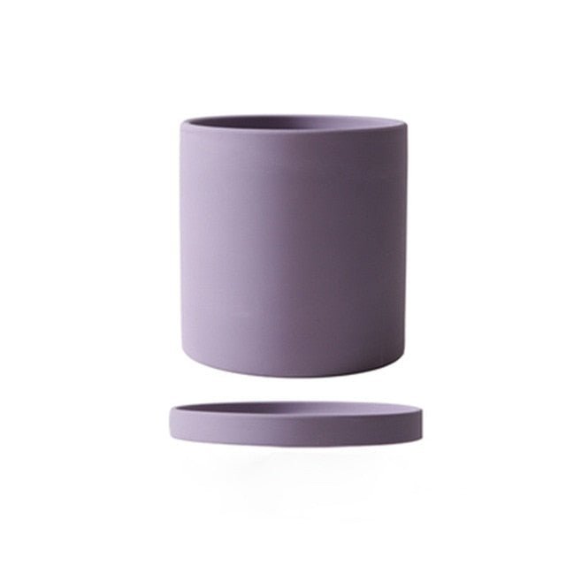 Functional ceramic indoor plant pot with saucer for optimal drainage and elegant decor.