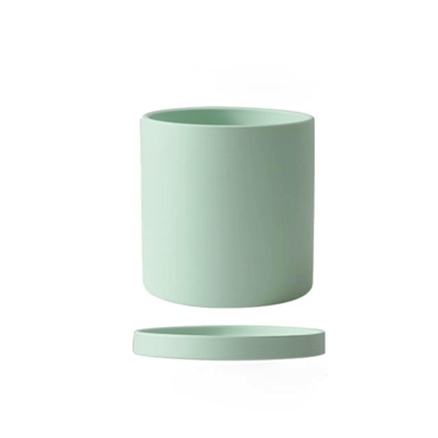 Simple yet elegant ceramic planter with saucer, enhancing the beauty of indoor plants.