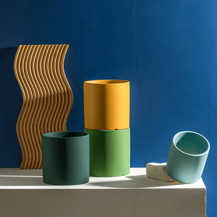 Ceramic planter with drainage saucer, perfect for indoor plants and modern home decor.