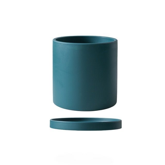 Ceramic flowerpot with drainage saucer, a must-have for elegant indoor plant arrangements.
