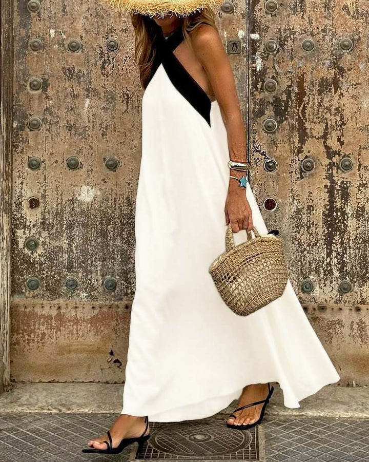 Black elegant cross-neck summer A-line dress for women. Sleeveless, ideal for chic casual vacations.
