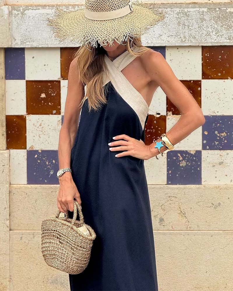 Stylish women's elegant cross-neck summer dress. Sleeveless A-line for chic casual vacation wear.