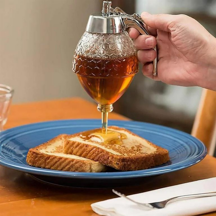 Drip-free honey & syrup dispenser. Clear plastic design, an elegant kitchen tool for mess-free breakfast serving.