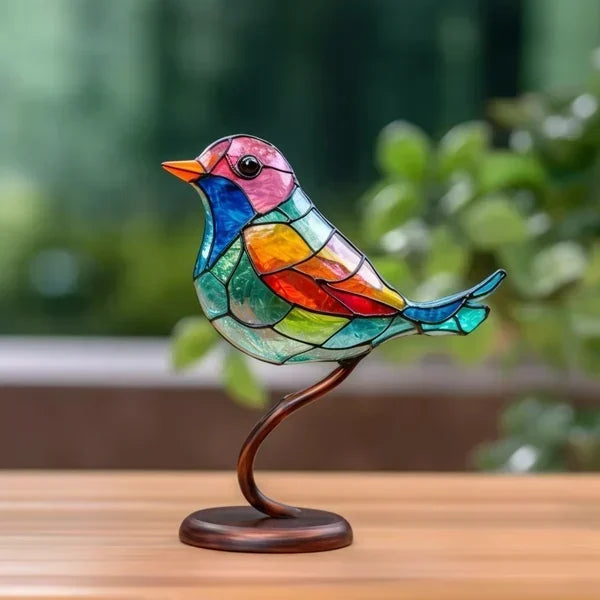 Elegant colored glass bird sculpture, perfect tabletop decor for modern living rooms.