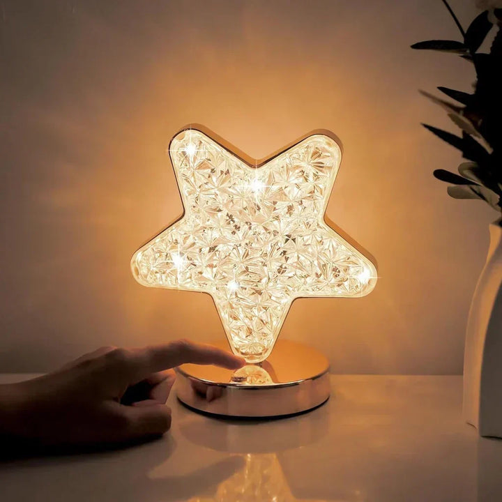 Dimmable LED crystal table lamp creating mood lighting for a cozy bedroom. Modern elegant night light for homes.