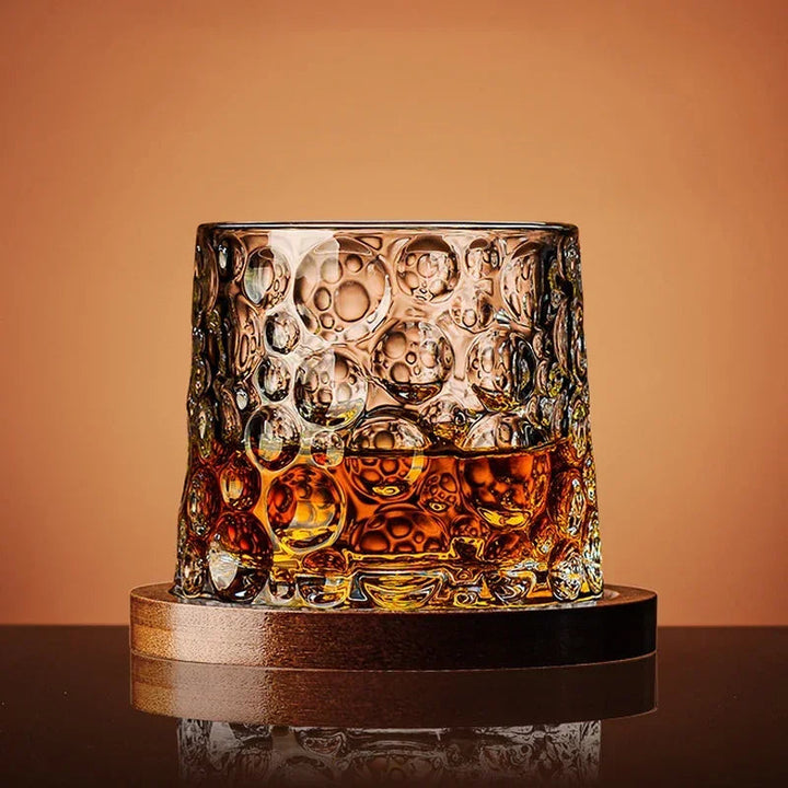 Close-up of a sparkling crystal whiskey tumbler, ideal for scotch, bourbon, or any spirit. High-quality drinkware.