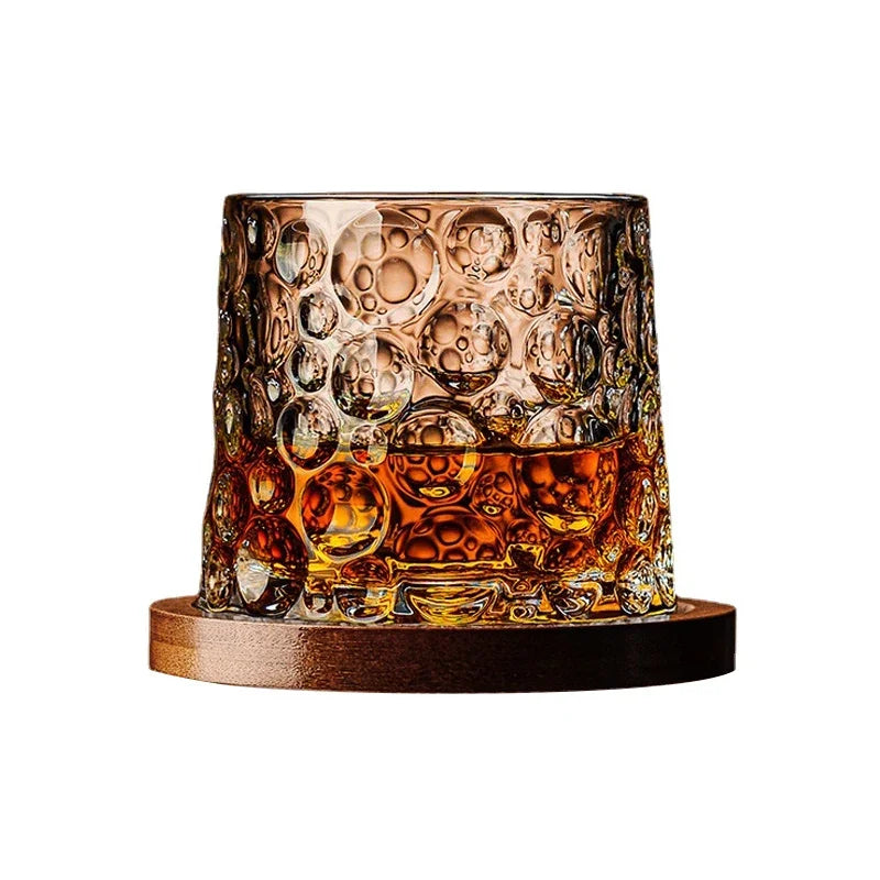 High-quality crystal whiskey tumblers with a sleek wooden base, premium barware for enjoying bourbon and scotch.