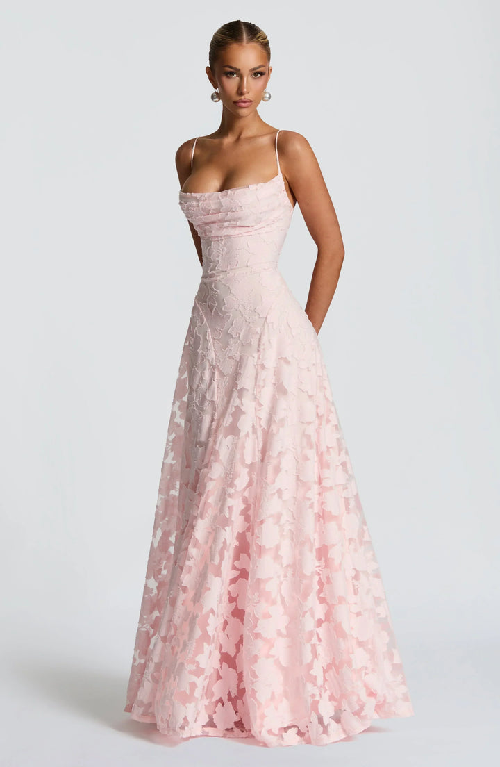 Gorgeous floral A-line formal maxi dress with elegant strappy details, perfect for any special occasion.