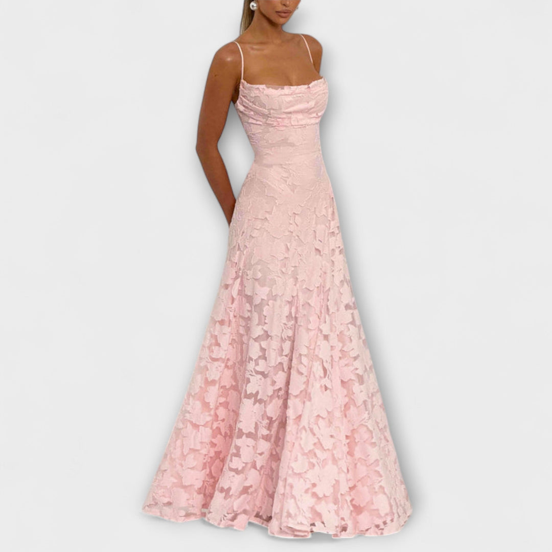 Close-up of delicate floral lace on an elegant women's maxi dress, perfect for a romantic special occasion.