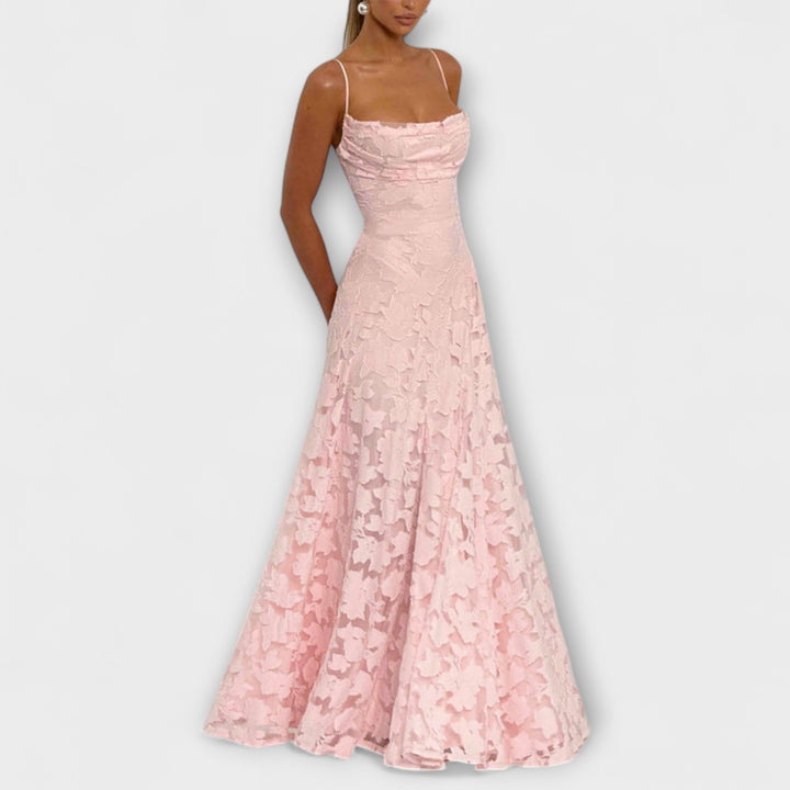 Close-up of delicate floral lace on an elegant women's maxi dress, perfect for a romantic special occasion.