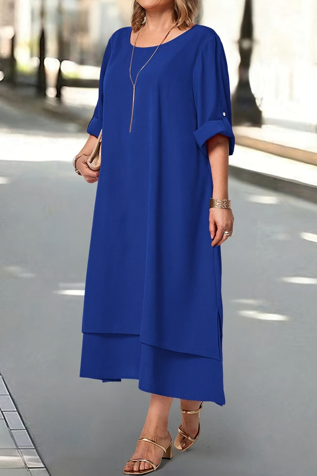 Sophisticated blue flowing maxi dress, comfortable and elegant for women's special occasions.