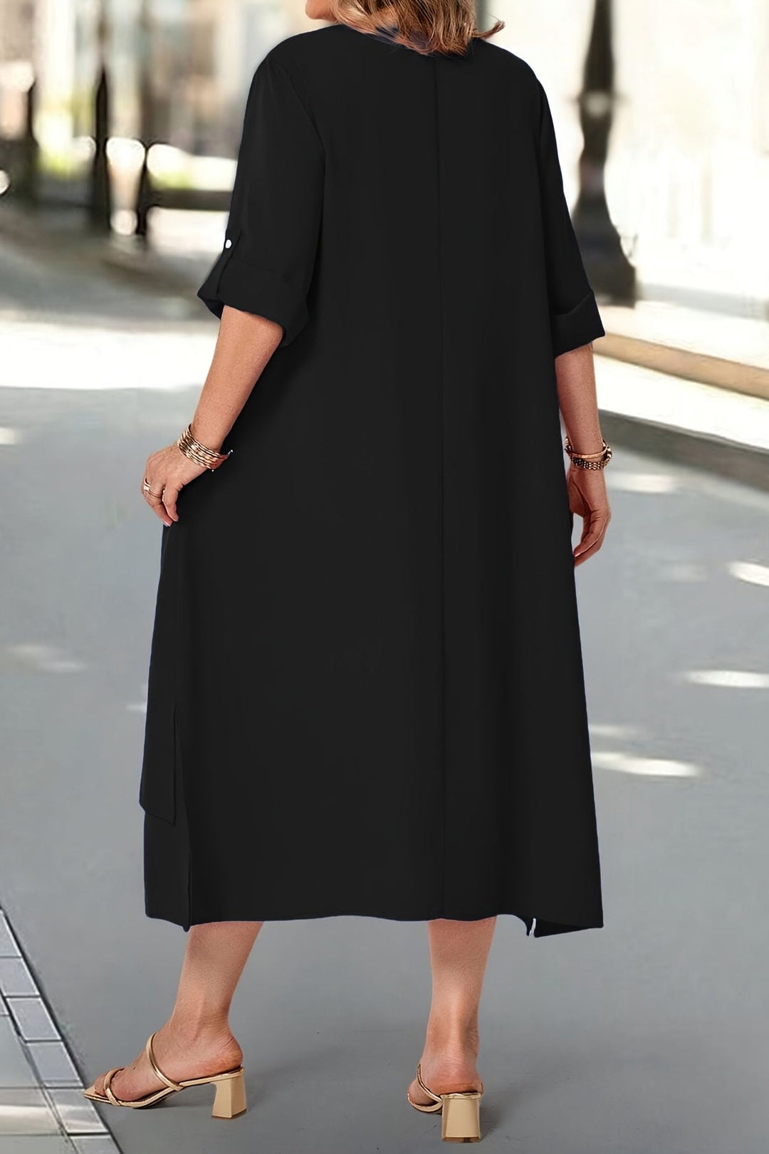 Flowing long women's dress with elegant silhouette, comfortable formal wear.