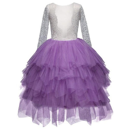 Full-length view of a girl wearing a white backless ruffledress, ideal for special occasions.