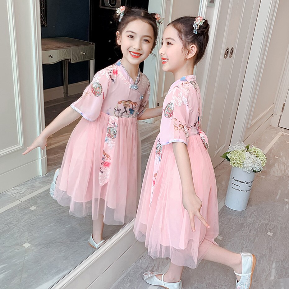 Stylish girls' cheongsam dress for special occasions, featuring an elegant tree print on soft polyester-cotton fabric.