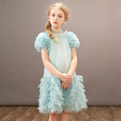 Elegant girls' dotted white tulle party dress with ruffled sleeves, perfect for birthdays & special occasions.