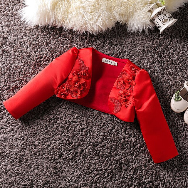 Stylish girls' bolero jacket with subtle floral appliques, great for party wear