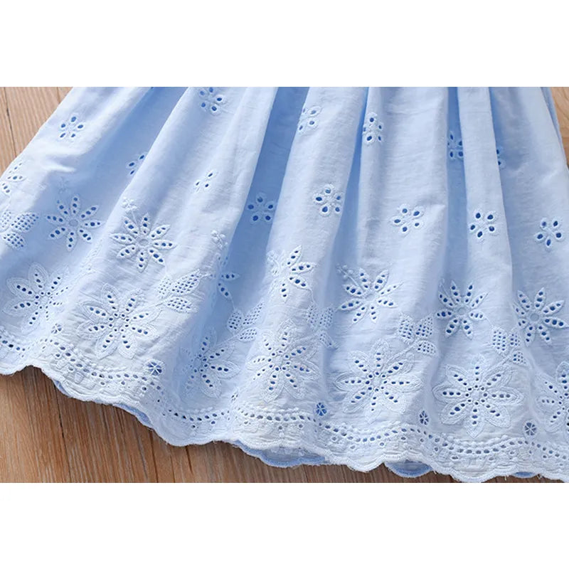 Young girl happily twirling in a beautiful princess tutu lace dress, kids fashion