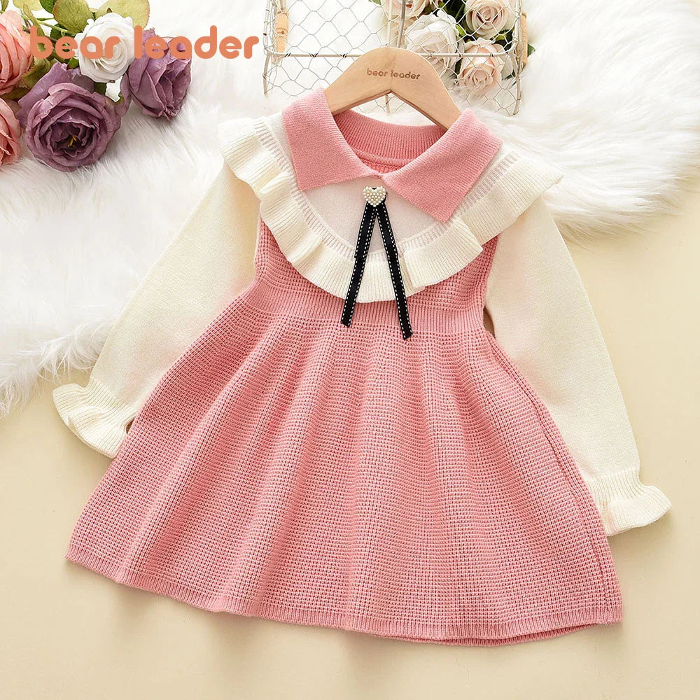 Casual yet elegant pink ruched sweater dress for young girls, perfect for winter outings