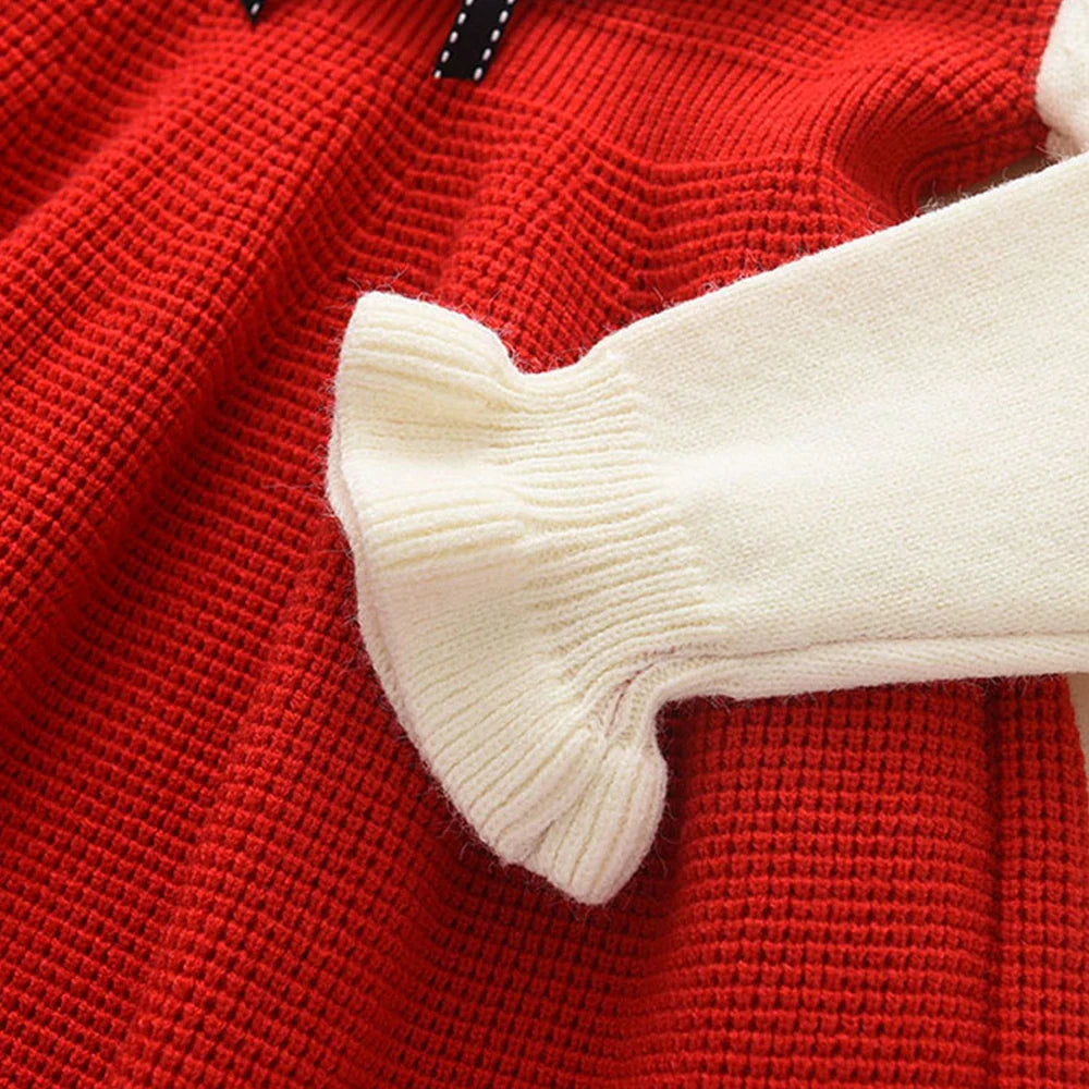 Soft pink knit sweater dress for girls, featuring fashionable ruching and an A-line silhouette