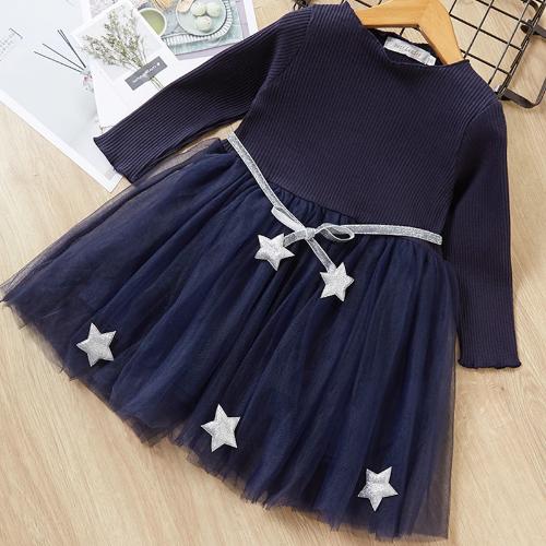 Detailed shot of the long sleeve and star pattern on a girls' mesh dress, elegant and comfortable.