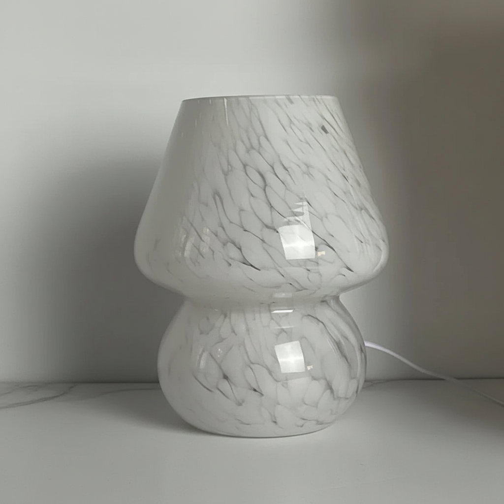 Artistic glass mushroom table lamp, creating a warm glow and enhancing interior design.