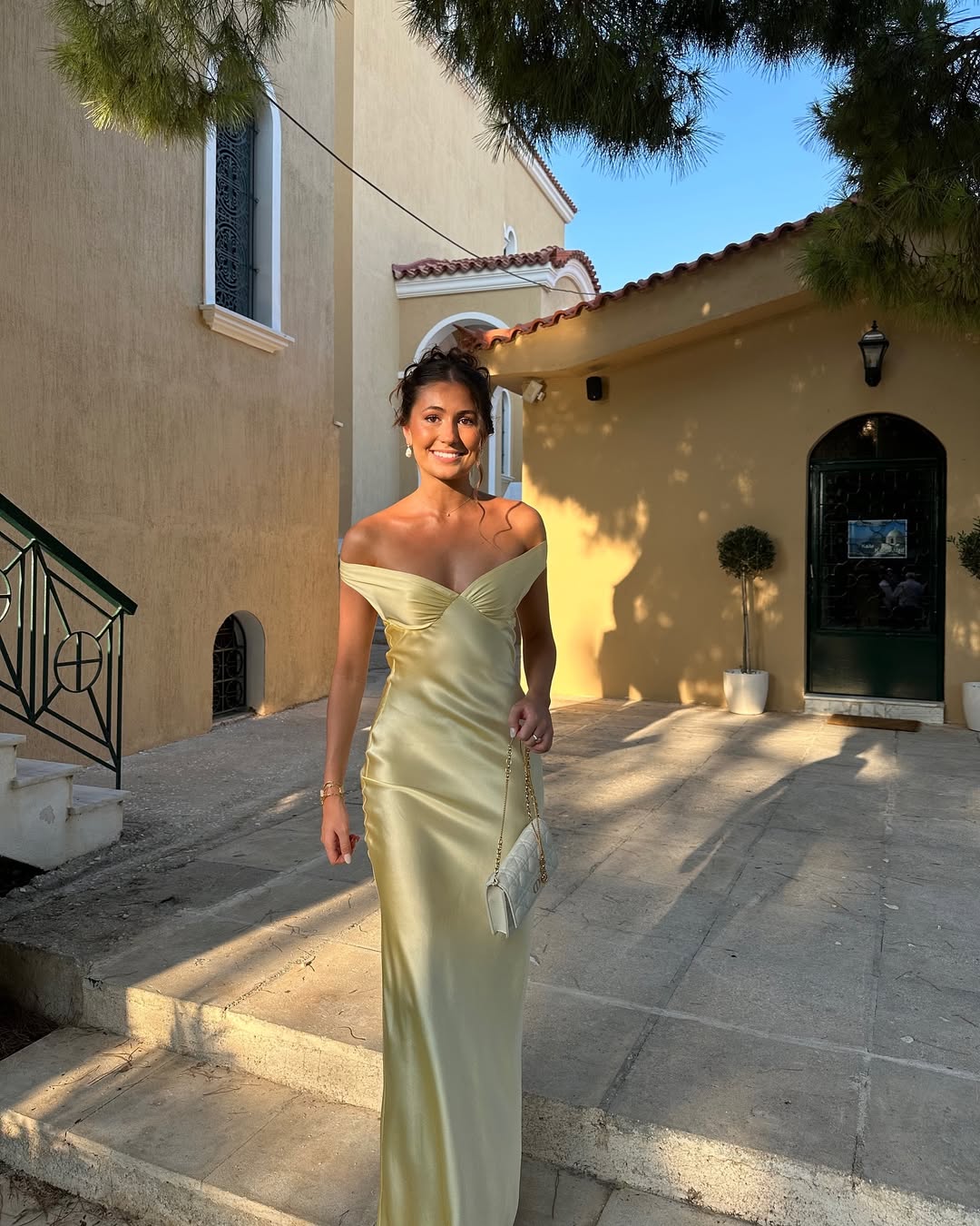 Elegant women's off-shoulder gold maxi dress, featuring a flattering bias cut, suitable for formal parties.